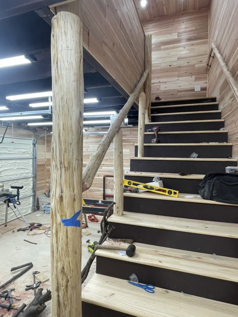 Basement stairway with new wood treads and black risers, work in progress